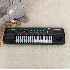 Музыкальный пианино..